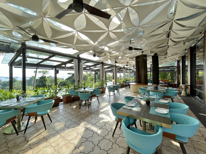 Outdoor seating area at The Cliff Italian restaurant at Sofitel Singapore Sentosa Resort & Spa