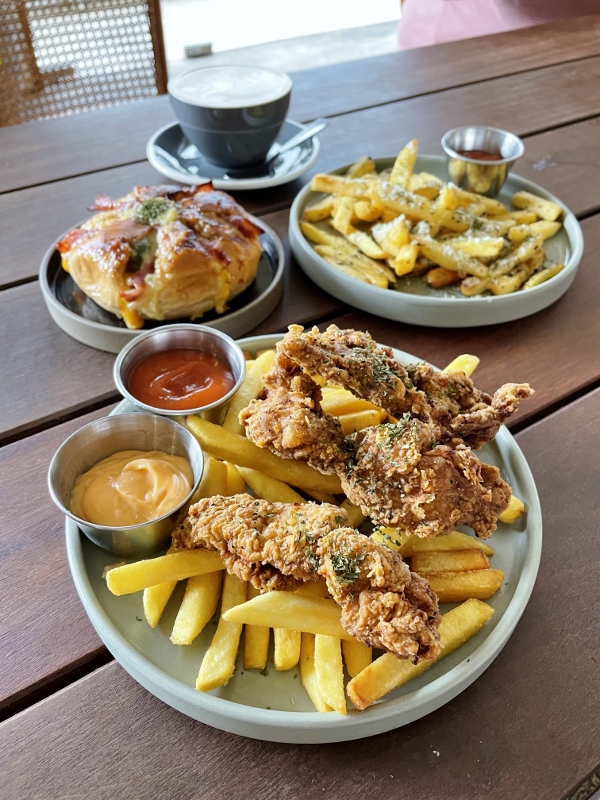 Buttermilk fried chicken and chips, ham and cheese garlic bread and truffle parmesan fries from from Hoods Coffee Cafe