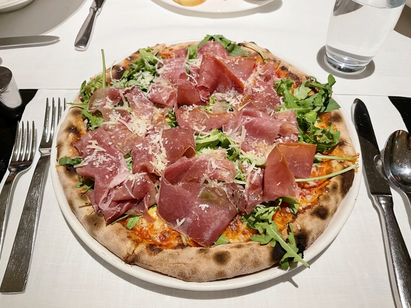 Prosciutto and arugula pizza from Basilico Italian Restaurant at Regent Hotel