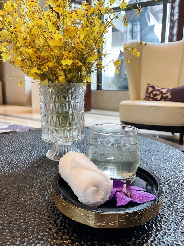 Welcome drink and cold towel at Siam Kempinski Hotel