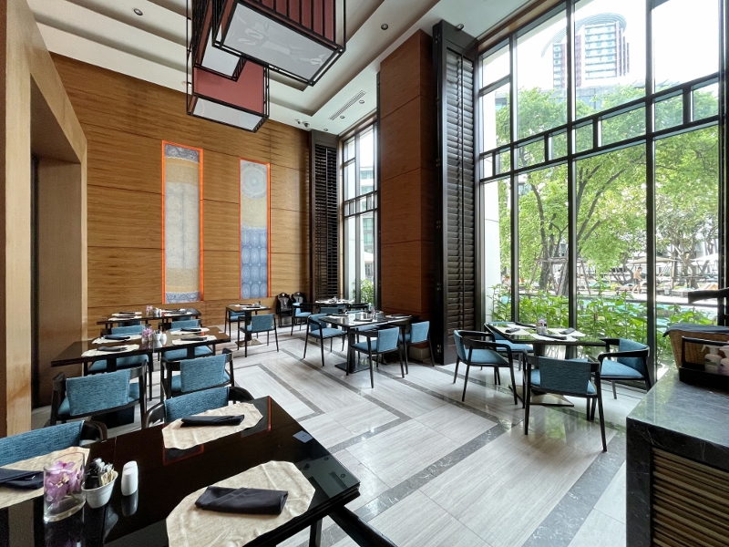 Seating area at The Addition restaurant at Siam Kempinski Hotel