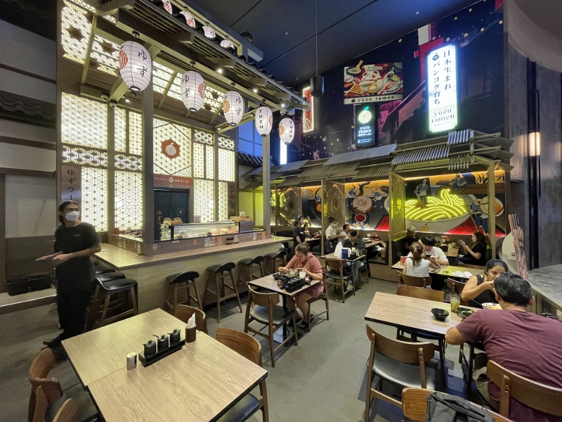 Seating area at Yuzu Ramen restaurant at ICONSIAM shopping mall