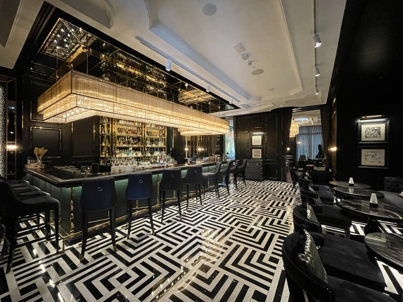 Seating area at Firefly Bar at Sindhorn Kempinski Hotel