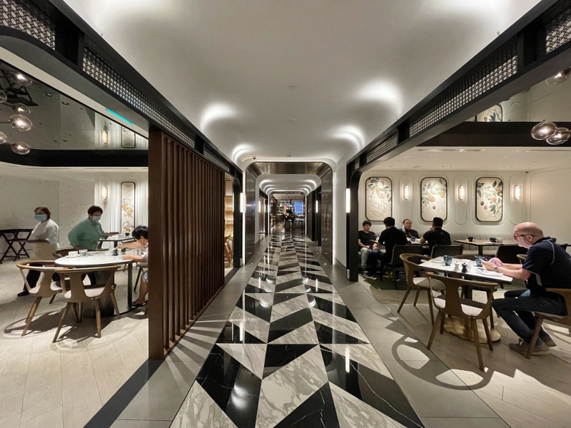 Seating area at Estate restaurant at Hilton Singapore Orchard Hotel