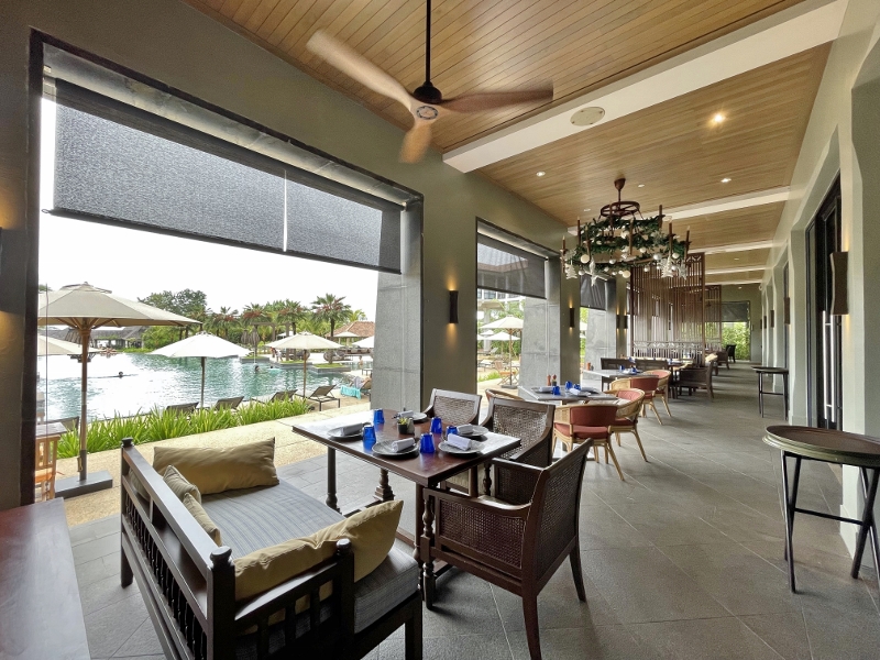 Outdoor seating area at Turmeric restaurant at Anantara Desaru Coast Resort & Villas