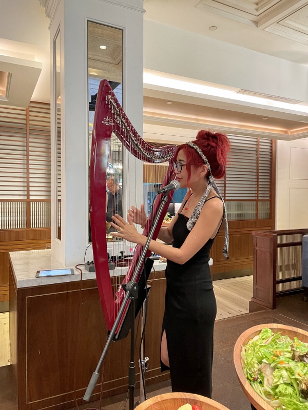 Harpist performing at 15 Stamford restaurant at The Capitol Kempinski Hotel