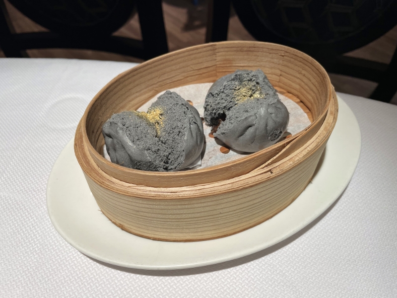 Steamed charcoal buns with black truffle and barbecued pork from Cassia restaurant at Capella Hotel
