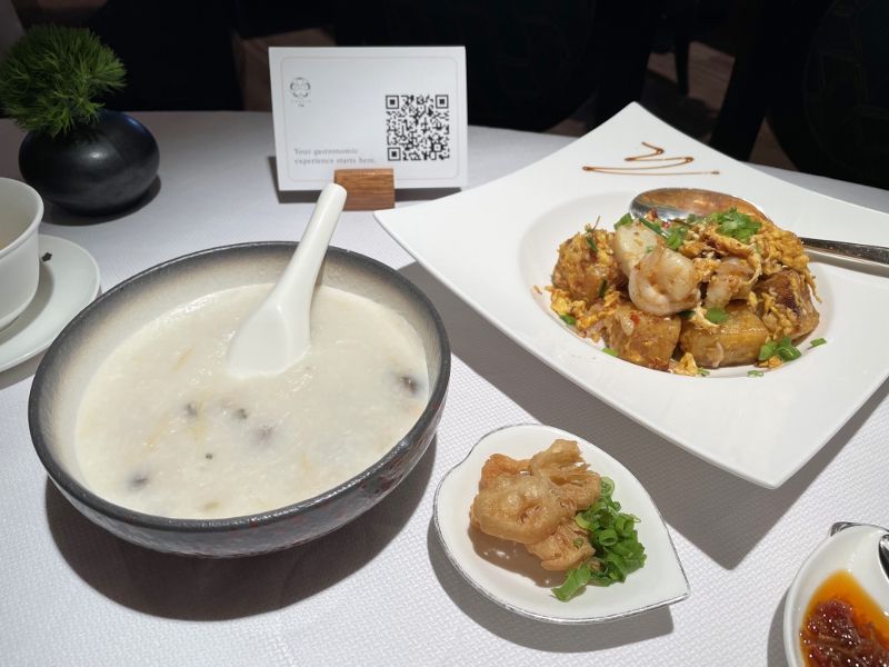 Shredded chicken and century egg porridge and wok-fried carrot cake with XO sauce from Cassia restaurant at Capella Hotel