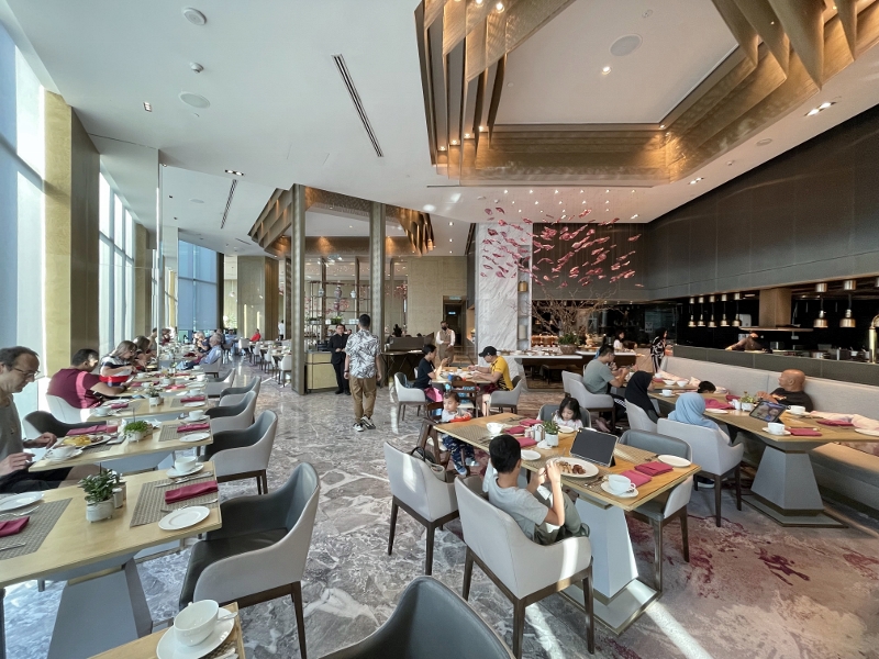 Seating area at Curate restaurant at Four Seasons Hotel Kuala Lumpur