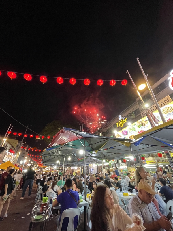 Fireworks display seen from Meng Kee Grill Fish restaurant at Jalan Alor Food Street & Night Market
