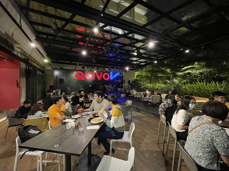 Outdoor seating area at Quivo restaurant at Mid Valley Southkey shopping mall