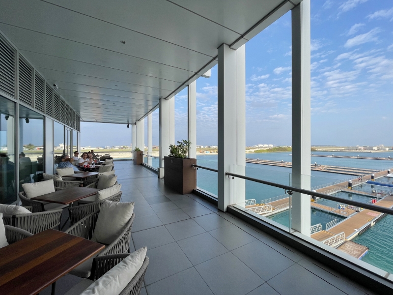 Outdoor seating area at Coral Lounge by TMA at Noovilu Seaplane Terminal