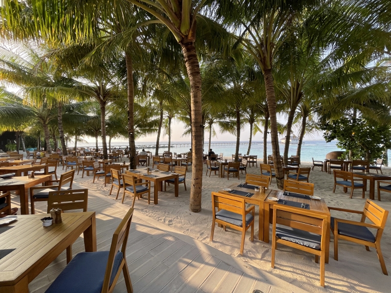 Seating area at ONU Marche restaurant and bar at Mövenpick Resort Kuredhivaru