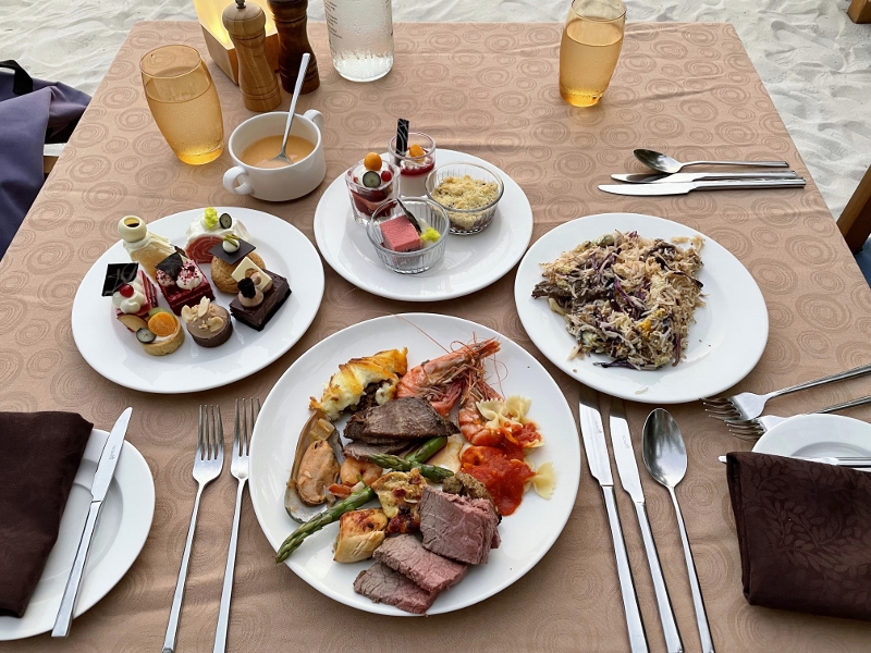 Dinner buffet dishes from ONU Marche restaurant and bar at Mövenpick Resort Kuredhivaru