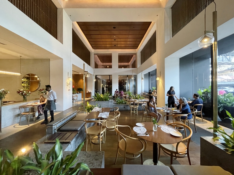 Seating area at Botanica+Co restaurant at Alila Bangsar Hotel Kuala Lumpur