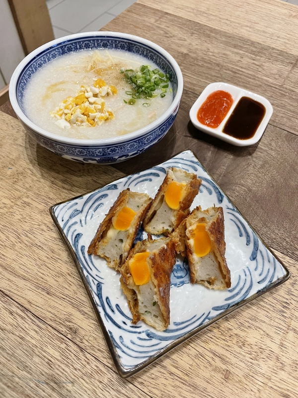 Salted egg and shredded chicken congee and golden fish crackers at Dolly Dim Sum restaurant at NU Sentral shopping mall