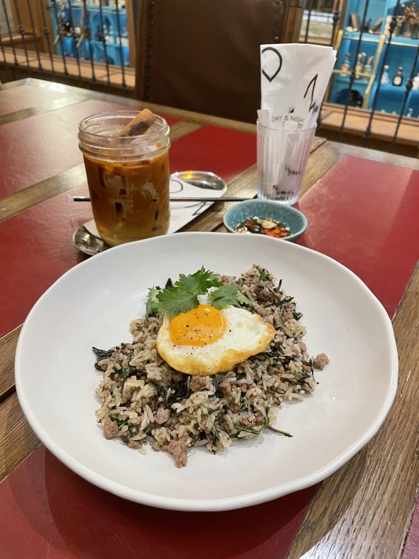 Thai basil fried rice with beef and premium Thai iced tea with homemade milk sauce from Day & Night Of Phuket Cafe