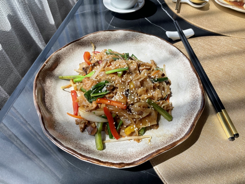 Wok-fried flat noodles with beef, capsicum and Hong Kong kale from Yue Restaurant & Bar at Courtyard by Marriott Hotel Phuket Town