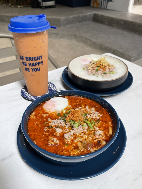 Tom yum instant noodles with pork, pork porridge with soft-boiled eggs and iced Thai milk tea from Cafe Dim Sum Restaurant