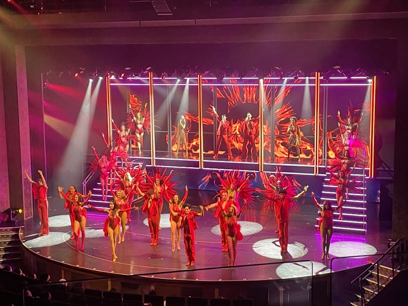 Performers on stage during Showgirl performance at Royal Theatre on Royal Caribbean Spectrum Of The Seas