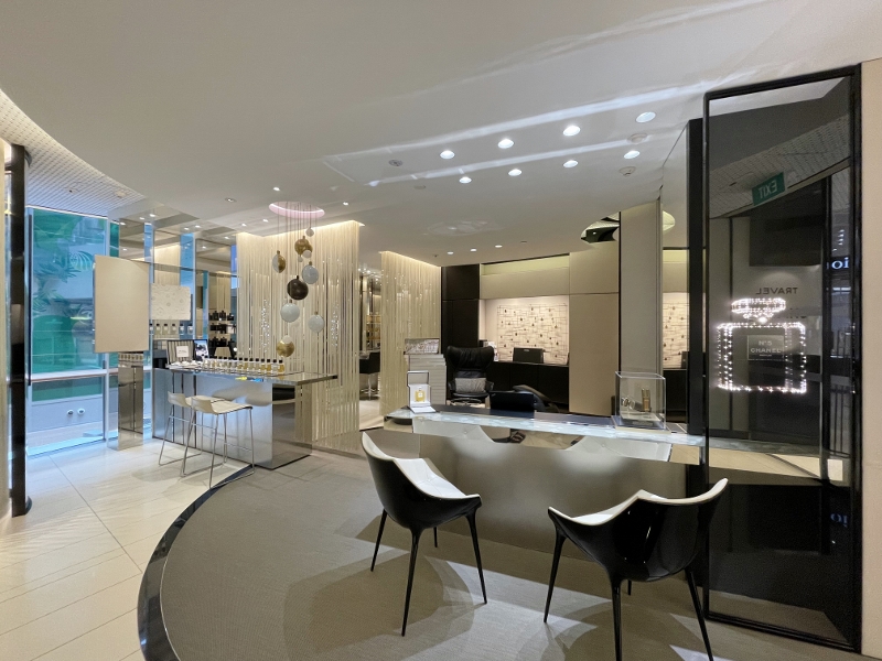 Seating area and product displays at Chanel Beauty Lounge at Changi Airport Terminal 3